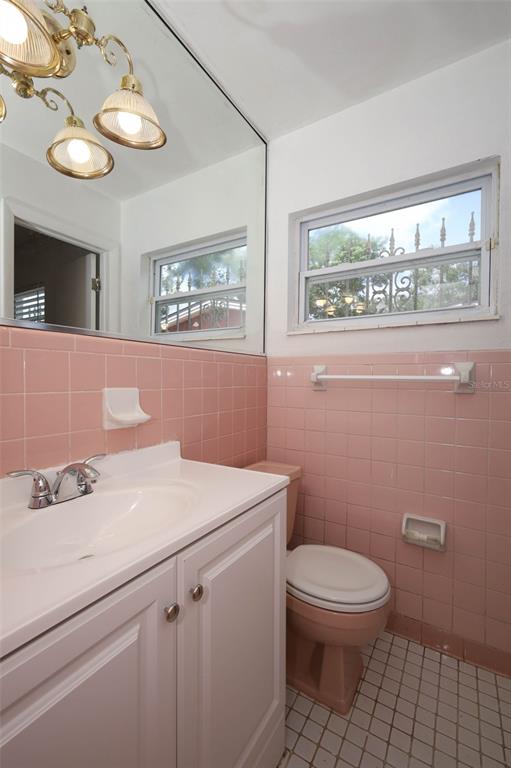 124 Salem Street Altamonte Springs, FL 32701 - Photo 31 of 45 a bathroom with a sink a toilet and a mirror