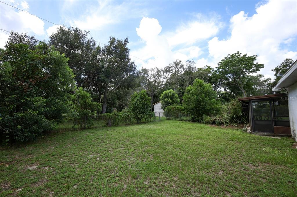 124 Salem Street Altamonte Springs, FL 32701 - Photo 40 of 45 a backyard of a house with lots of green space