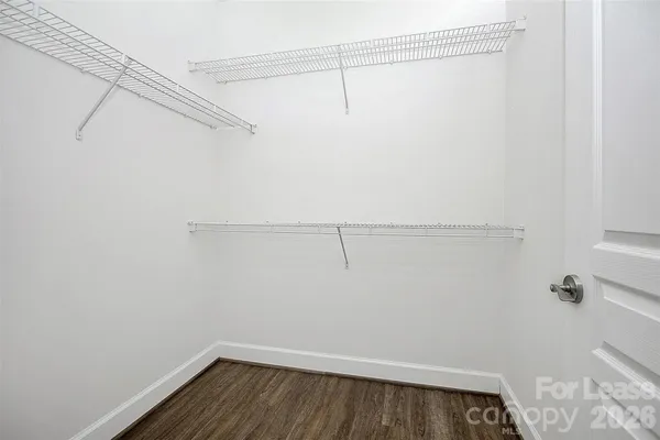a bathroom with a glass door shower and a mirror