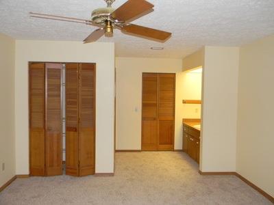 1683 Northwest Spruce Ridge Drive Stuart, FL 34994 - Photo 11 of 23 an empty room with closet and a ceiling fan