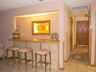 1683 Northwest Spruce Ridge Drive Stuart, FL 34994 - Photo 15 of 23 a kitchen with a table and chairs in it