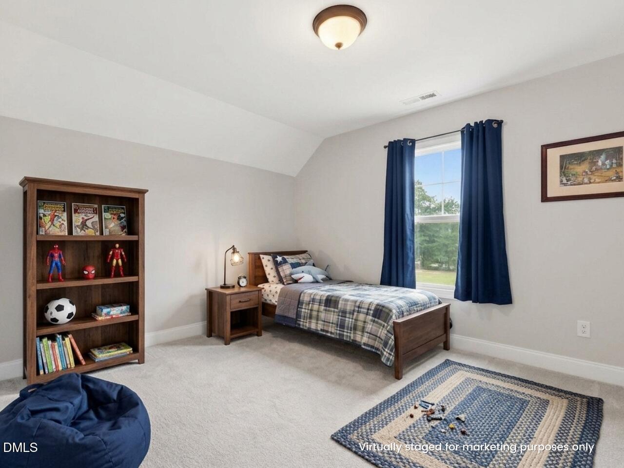 5098 Spring Hill Church Road Lillington, NC 27546 - Photo 27 of 36 a bedroom with furniture and a book shelf