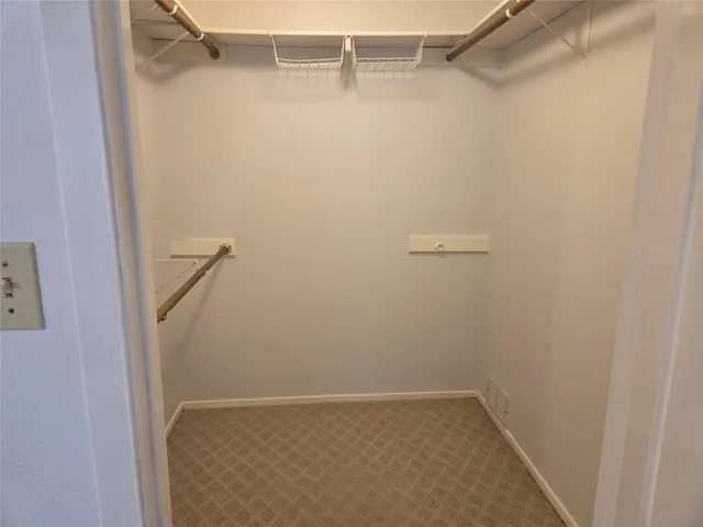 a bathroom with a granite countertop sink and a white cabinet