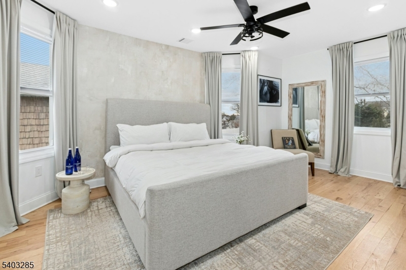 721 Summit Street Linden, NJ 07036 - Photo 11 of 27 a spacious bedroom with a bed and glass door