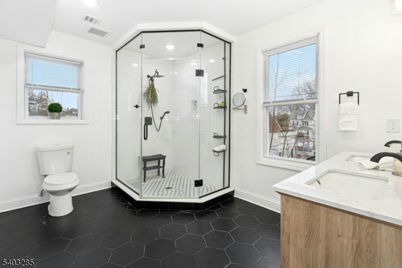 721 Summit Street Linden, NJ 07036 - Photo 13 of 27 a bathroom with a sink a toilet and shower