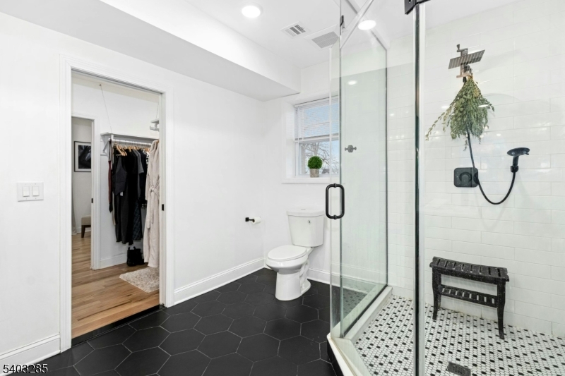 721 Summit Street Linden, NJ 07036 - Photo 14 of 27 a bathroom with a toilet and a shower