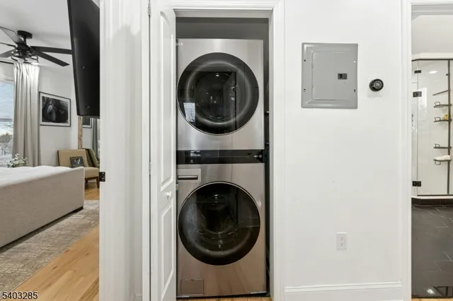 a view of a bedroom with washer and dryer