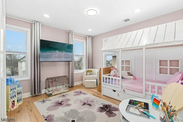 a bedroom with furniture and a fireplace