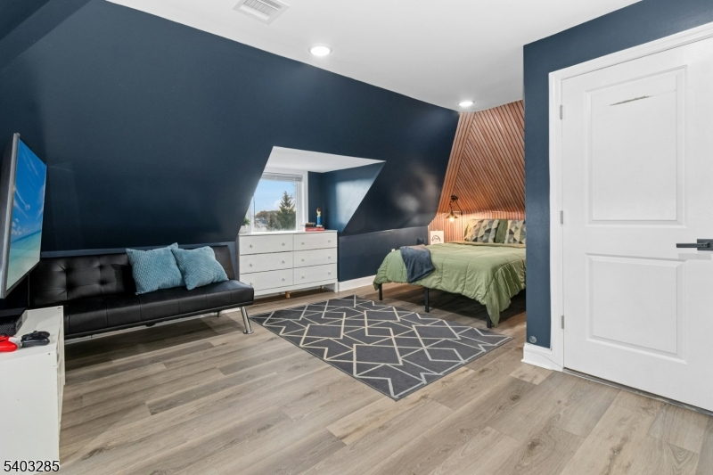 721 Summit Street Linden, NJ 07036 - Photo 18 of 27 a living room with furniture and a wooden floor