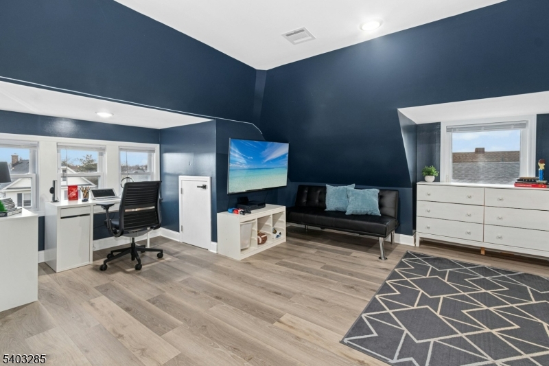 721 Summit Street Linden, NJ 07036 - Photo 19 of 27 a view of workspace with wooden floor and windows