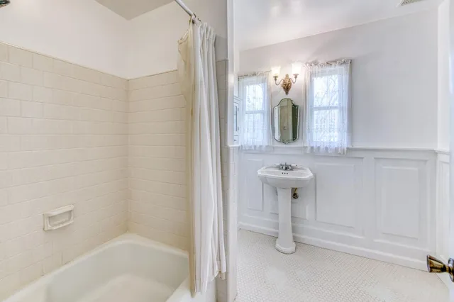 a bathroom with a shower and a toilet