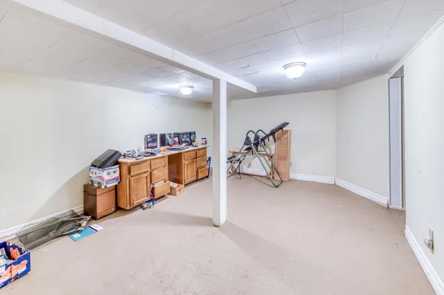 a view of a yard with wooden fence