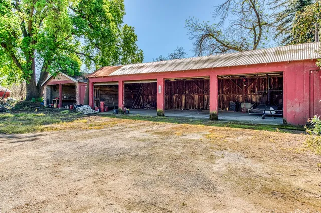 a front view of a house with a yard and a garage