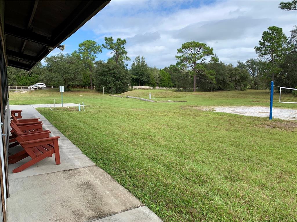 2 Quince Avenue Eustis, FL 32736 - Photo 18 of 22 a view of a garden with a swimming pool