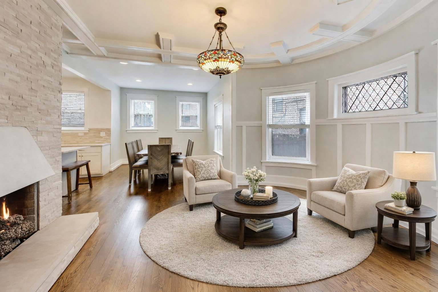 7015 North Sheridan Road Chicago, IL 60626 - Photo 6 of 40 a living room with furniture a chandelier and a fireplace