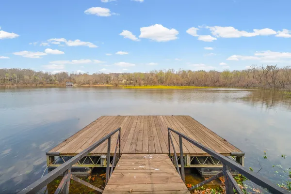 a view of a lake with outdoor seating