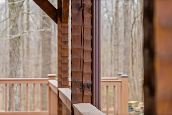 a patio with wooden floors and wooden walls