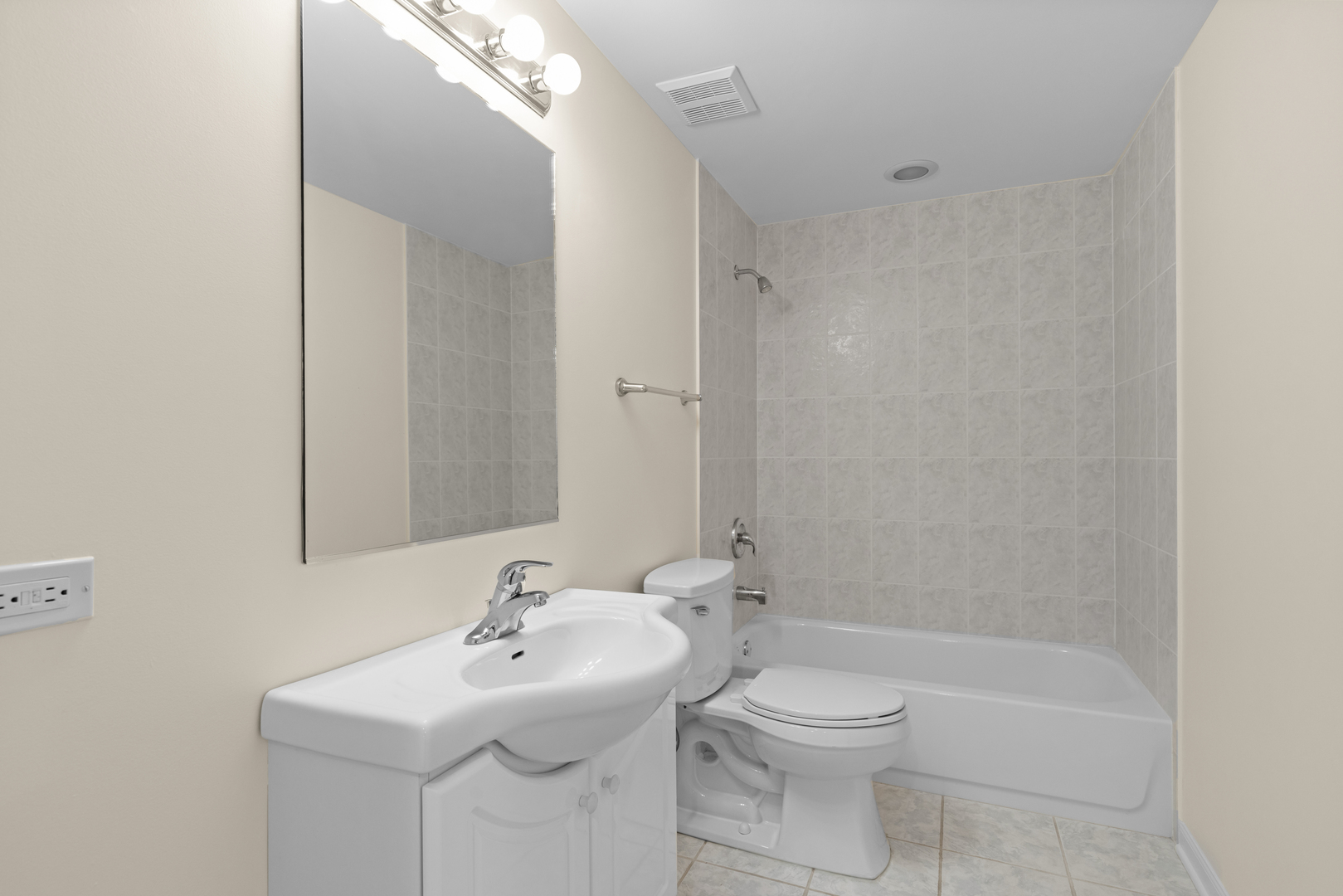 1723 Wildberry Drive, Unit C Glenview, IL 60025 - Photo 25 of 34 a bathroom with a sink a toilet and shower