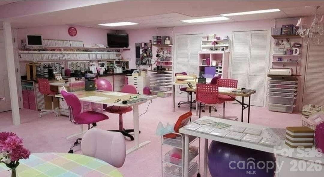 476 Jackson Loop Road Flat Rock, NC 28731 - Photo 21 of 37 a view of a play room with furniture and wooden floor