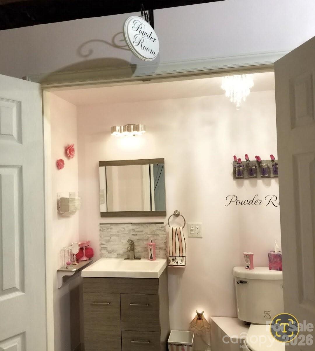 476 Jackson Loop Road Flat Rock, NC 28731 - Photo 22 of 37 a bathroom with a sink mirror vanity and toilet