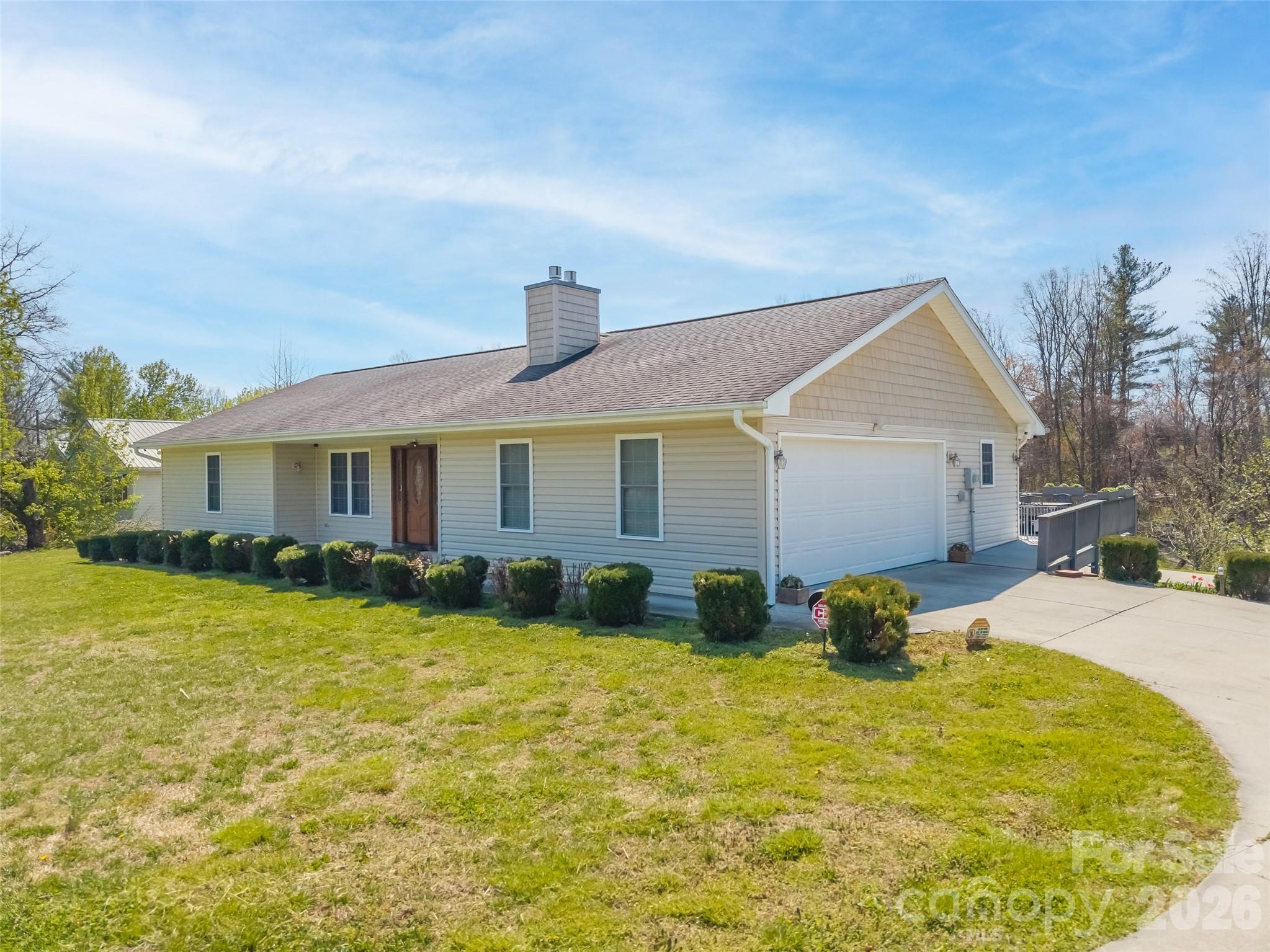 476 Jackson Loop Road Flat Rock, NC 28731 - Photo 25 of 37 a front view of house with yard outdoor seating and barbeque oven