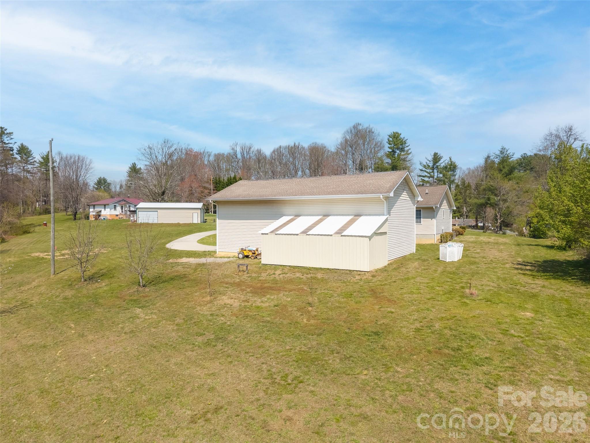 476 Jackson Loop Road Flat Rock, NC 28731 - Photo 25 of 34 a view of a lake with houses in the back