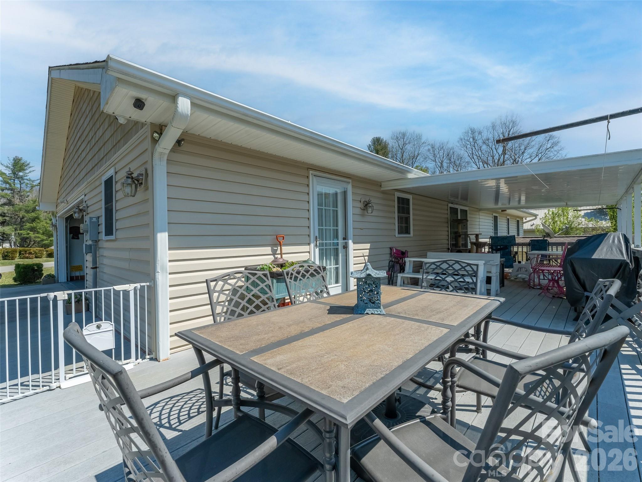 476 Jackson Loop Road Flat Rock, NC 28731 - Photo 26 of 34 a view of a patio with a table and chairs