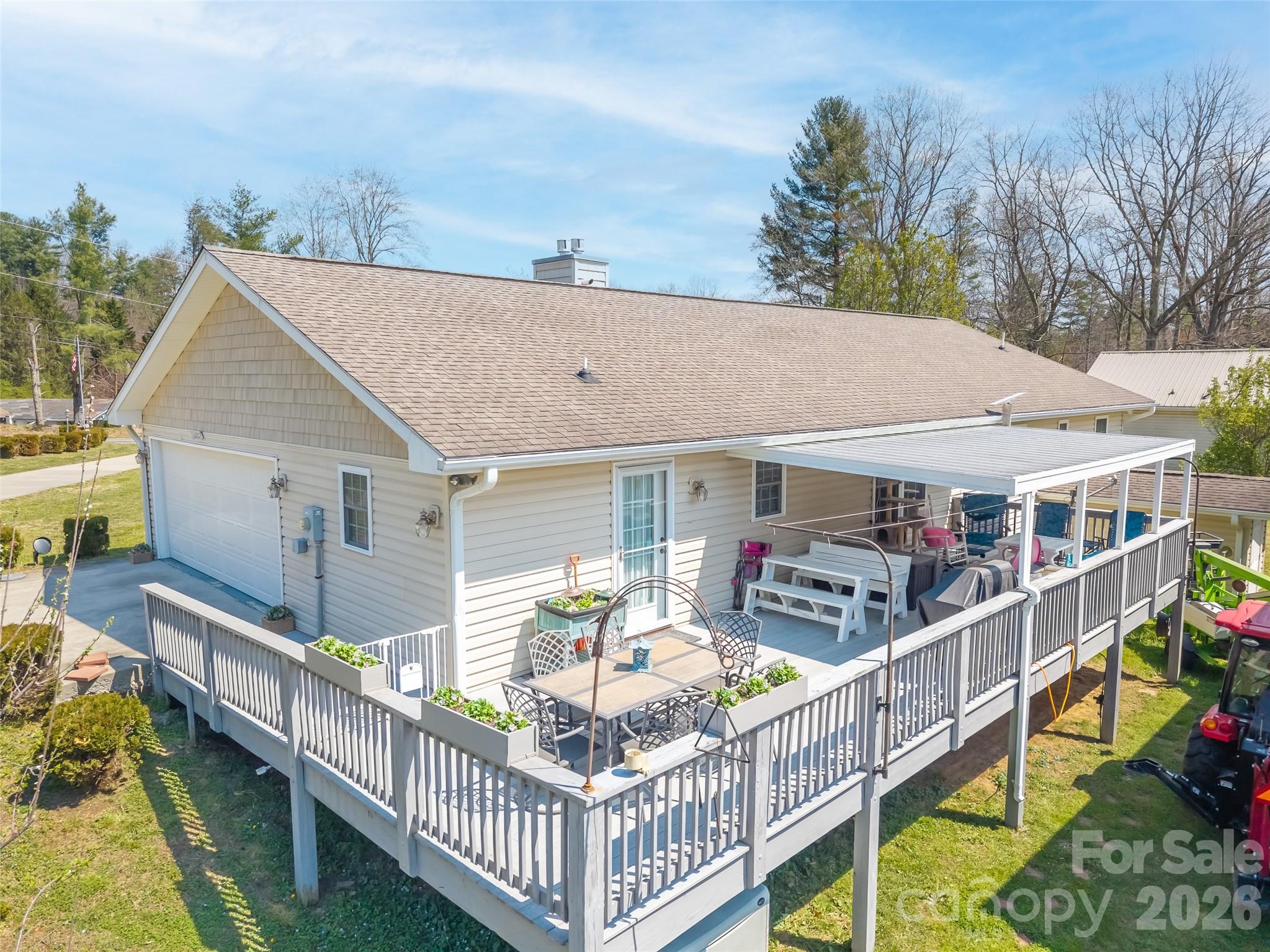 476 Jackson Loop Road Flat Rock, NC 28731 - Photo 26 of 37 a view of house along with deck and outdoor seating