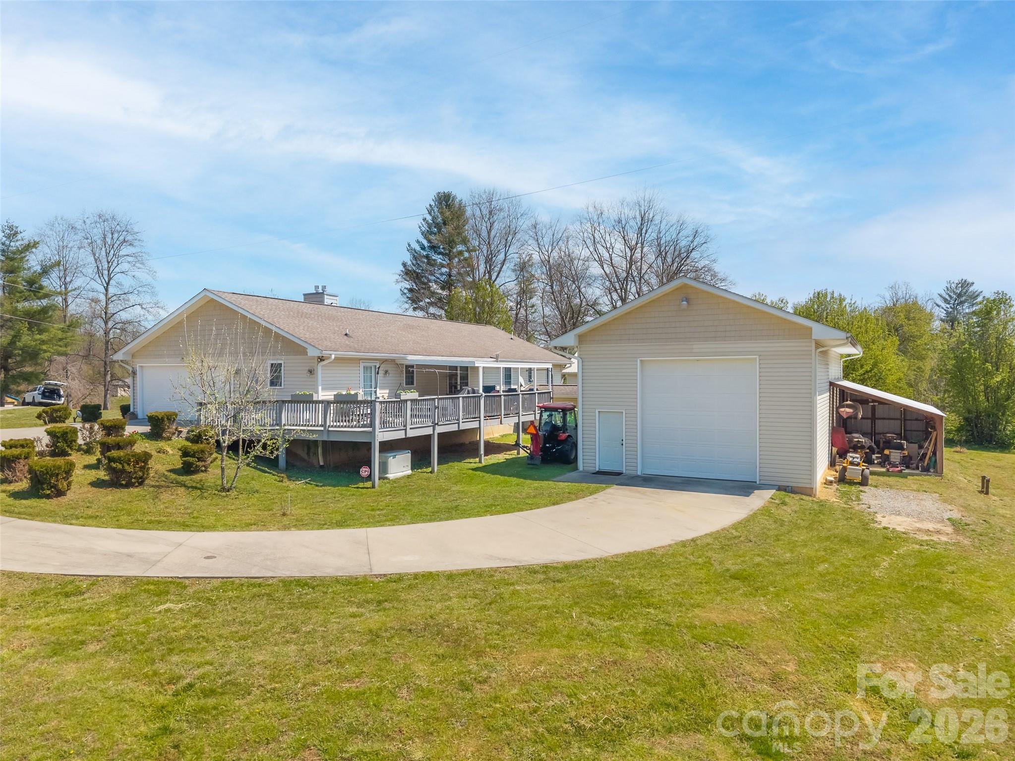 476 Jackson Loop Road Flat Rock, NC 28731 - Photo 28 of 37 a view of a house with a yard and sitting area