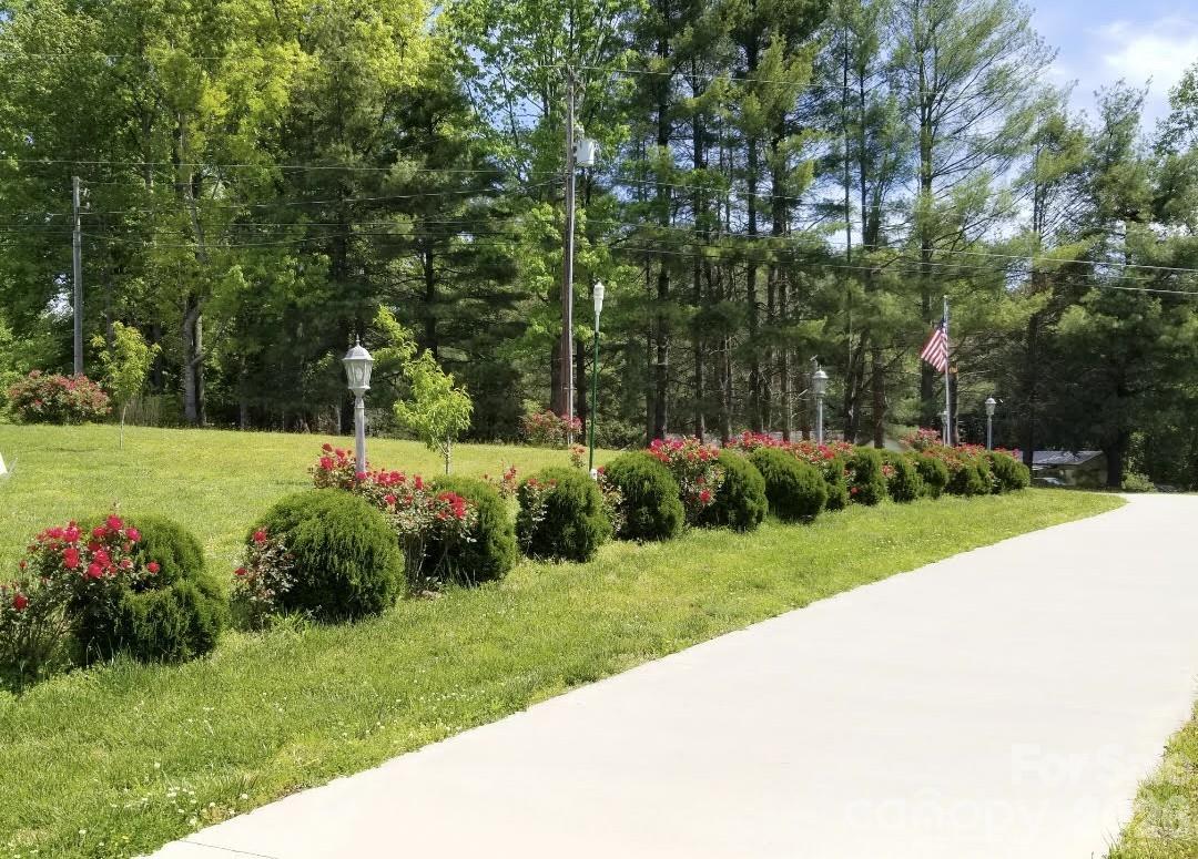 476 Jackson Loop Road Flat Rock, NC 28731 - Photo 34 of 37 a view of a garden with a pathway