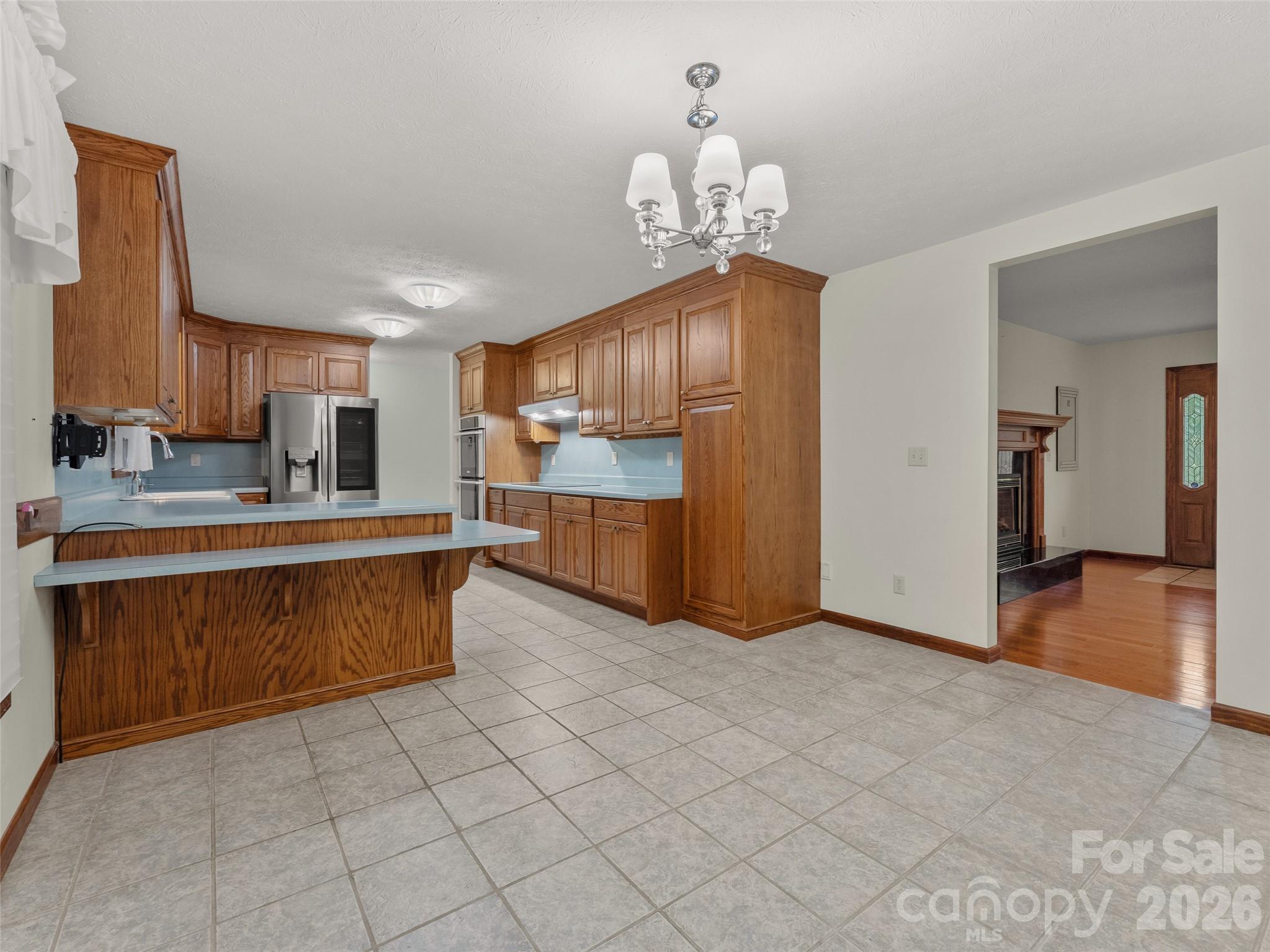 476 Jackson Loop Road Flat Rock, NC 28731 - Photo 6 of 34 a kitchen with stainless steel appliances granite countertop a refrigerator and a sink