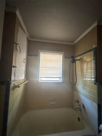 a bathroom with a bath tub