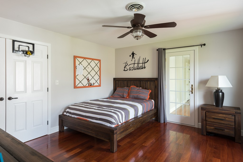 182 River Road Hanover, MA 02339 - Photo 24 of 29 a bedroom with a bed and wooden floor