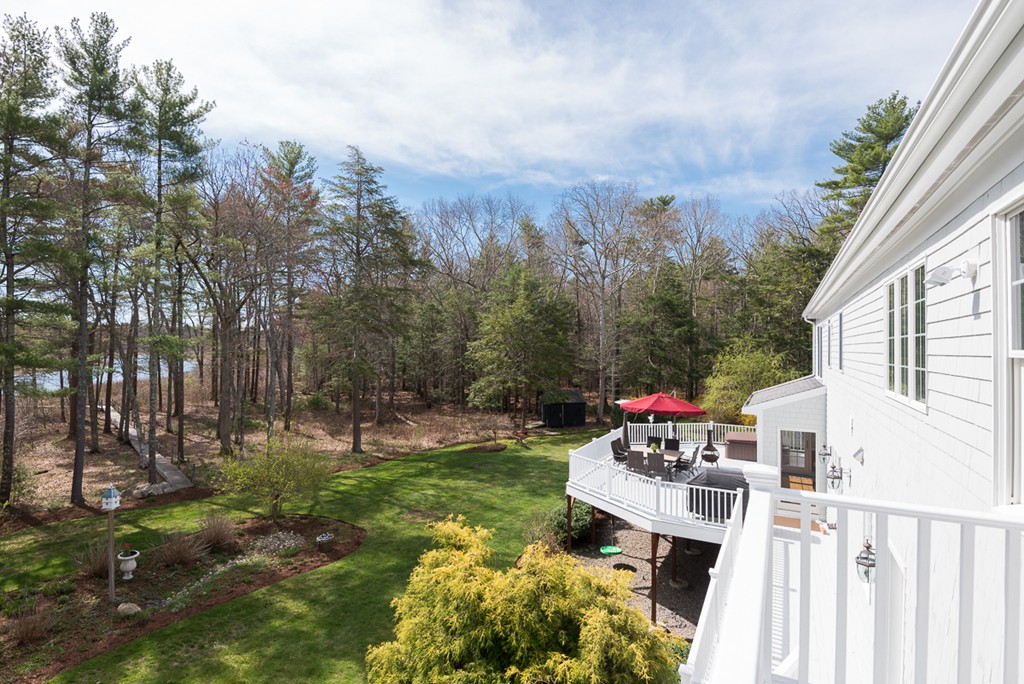 182 River Road Hanover, MA 02339 - Photo 25 of 29 a backyard of a house with table and chairs