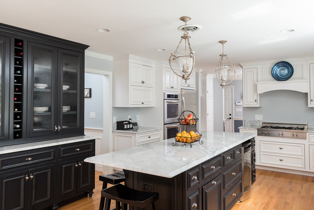 182 River Road Hanover, MA 02339 - Photo 9 of 29 a kitchen with cabinets a sink a center island and appliances