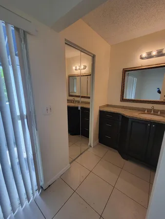 a bathroom with a toilet and shower