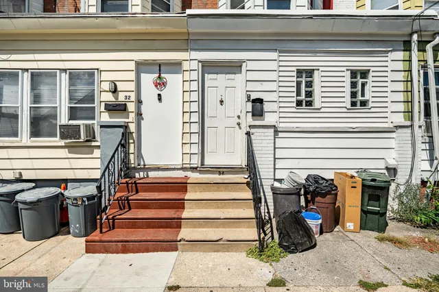 a view of wooden floor and windows in a room