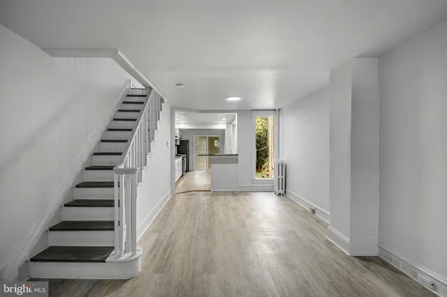 a kitchen with stainless steel appliances granite countertop a refrigerator and a stove
