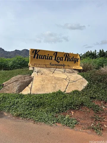 a view of a sign board with yard