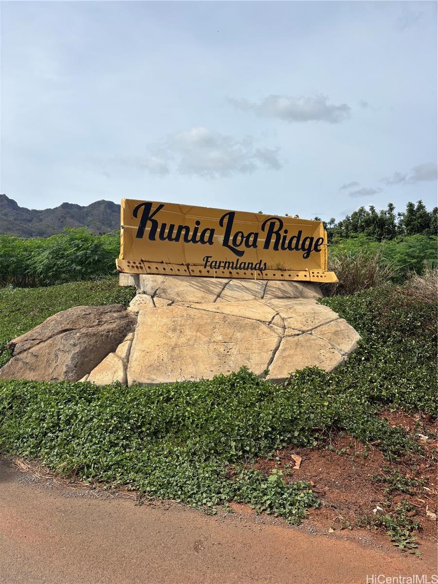 a view of a sign board with yard