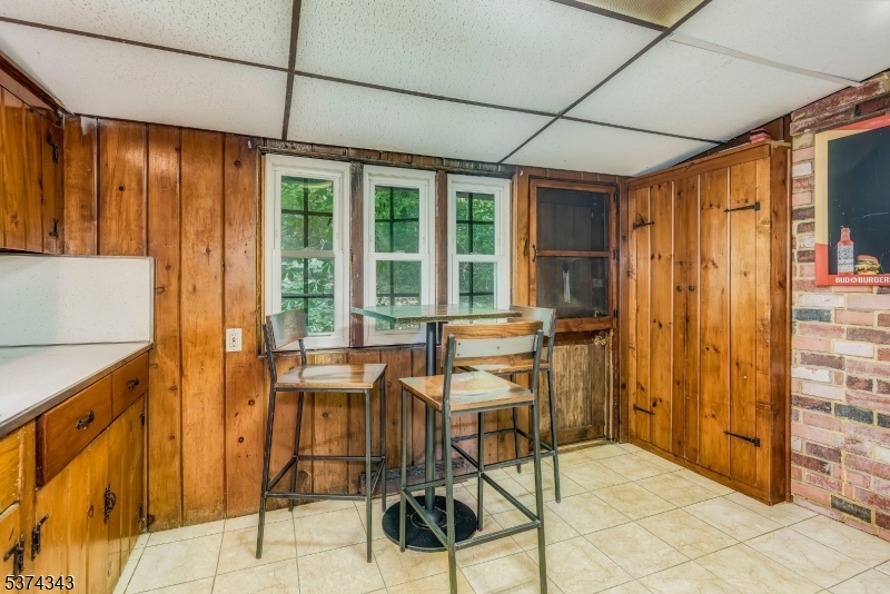 114 Pocantecs Road Vernon, NJ 07422 - Photo 11 of 20 a view of a dining room with furniture window and outside view