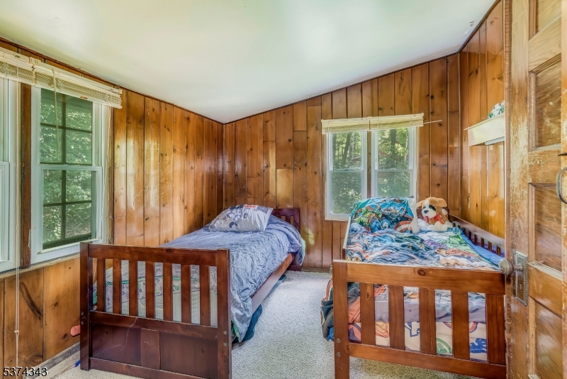 114 Pocantecs Road Vernon, NJ 07422 - Photo 14 of 20 a bedroom with furniture and a window