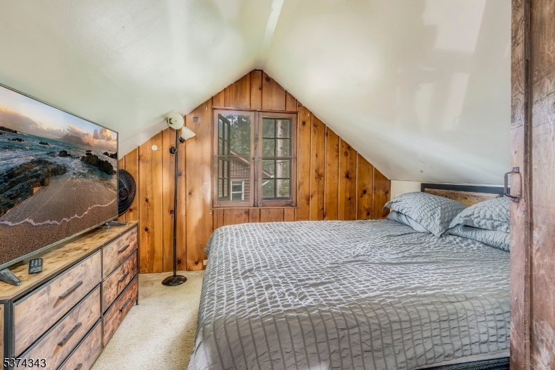 114 Pocantecs Road Vernon, NJ 07422 - Photo 15 of 20 a bedroom with a bed and a dresser