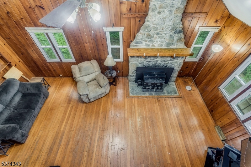 114 Pocantecs Road Vernon, NJ 07422 - Photo 16 of 20 a view of living room with furniture and wooden floor
