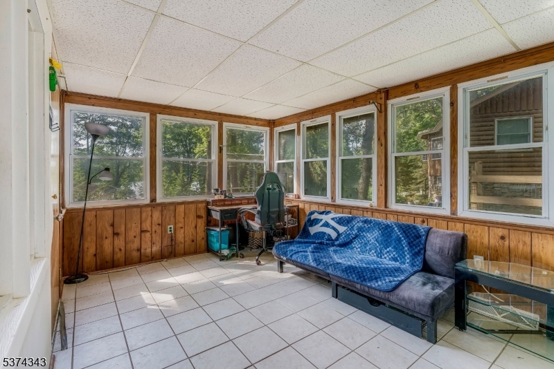 114 Pocantecs Road Vernon, NJ 07422 - Photo 18 of 20 a living room with furniture and large windows