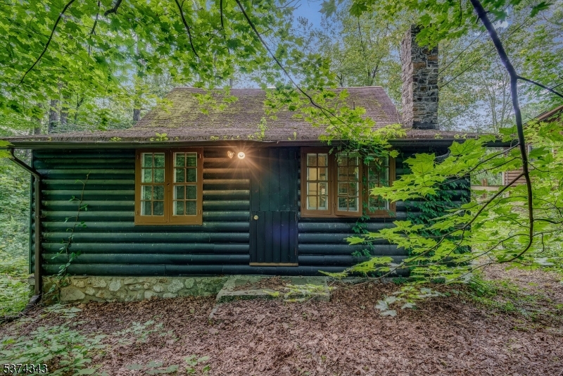 114 Pocantecs Road Vernon, NJ 07422 - Photo 19 of 20 a view of a house with a yard and plants