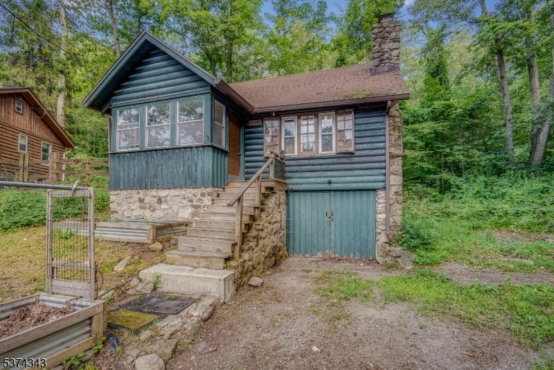 114 Pocantecs Road Vernon, NJ 07422 - Photo 2 of 20 a view of a house that has a small garden