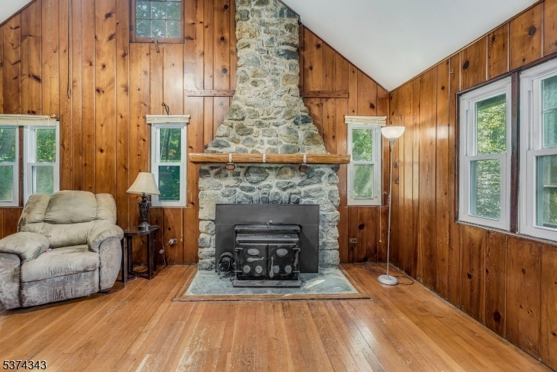 114 Pocantecs Road Vernon, NJ 07422 - Photo 5 of 20 a living room with furniture and a fireplace