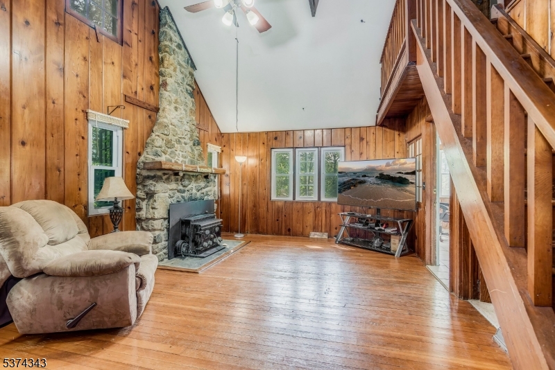 114 Pocantecs Road Vernon, NJ 07422 - Photo 6 of 20 a living room with furniture and a fireplace