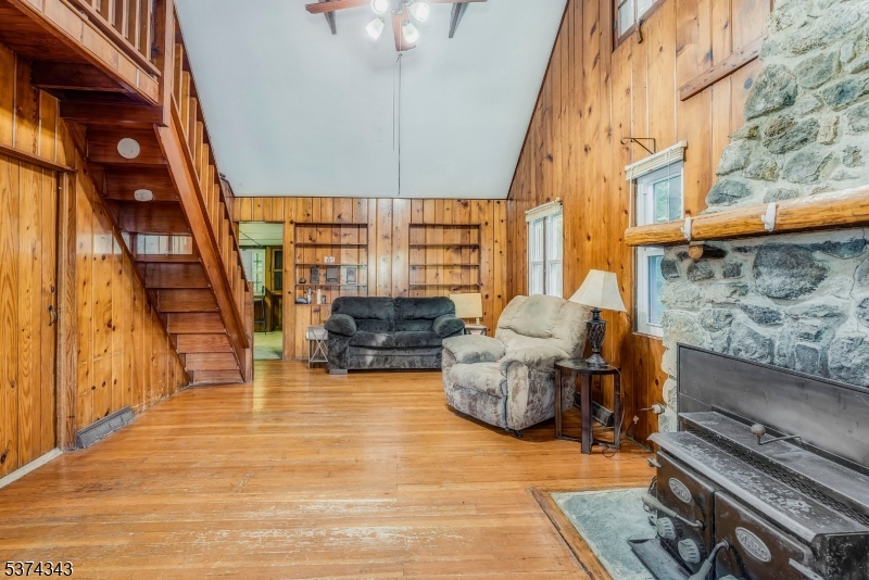 114 Pocantecs Road Vernon, NJ 07422 - Photo 7 of 20 a living room with furniture and a fireplace